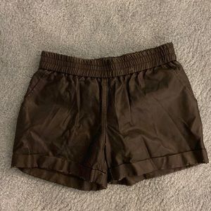 Black leather shorts.